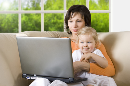 clipping path! mother with daughter on the sofa