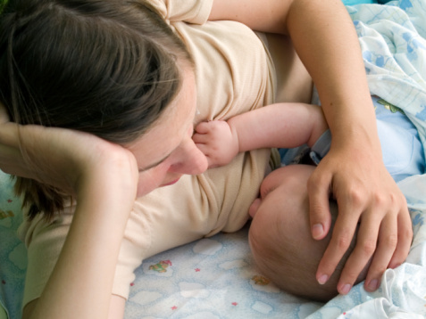 mother breast feeding her baby