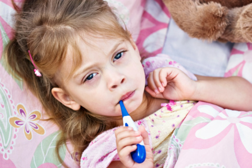 Ill Child with Thermometer