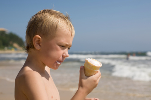 boy. beach. ice cream